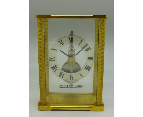A Jaeger LeCoultre brass cased mantel timepiece, height 11.5cm