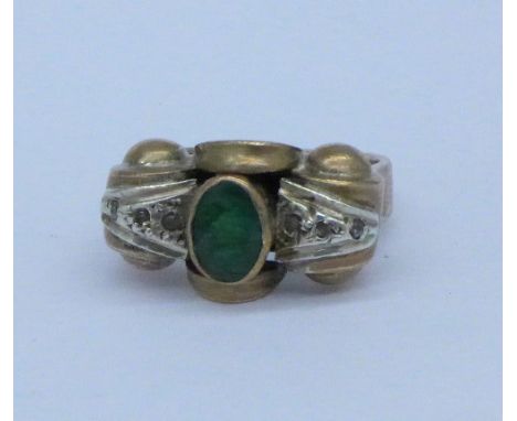 An Art Deco diamond and emerald set ring, M