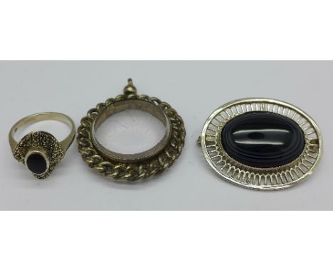 A silver ring, a pendant mount and a bullseye agate brooch
