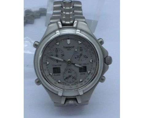 A Tissot 1853 chronograph quartz wristwatch with spare links, titanium case and bracelet