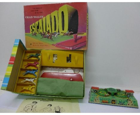 A Chad Valley Escalado game, boxed and a tin-plate clockwork diorama