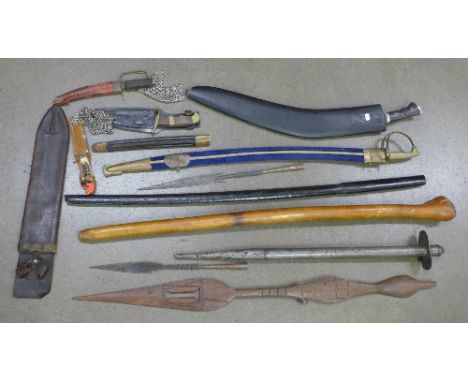 Three daggers, a kukri, sword, spears, training stick and scabbards, etc.