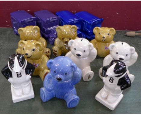 A collection of thirteen Wade novelty money boxes;- two Cadbury vans, two Boots vans, seven Teddy bears and two badgers