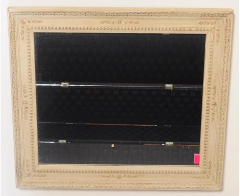 A vintage 20th century French country style white painted wall mirror having beaded and floral molded decoration to frame. Me