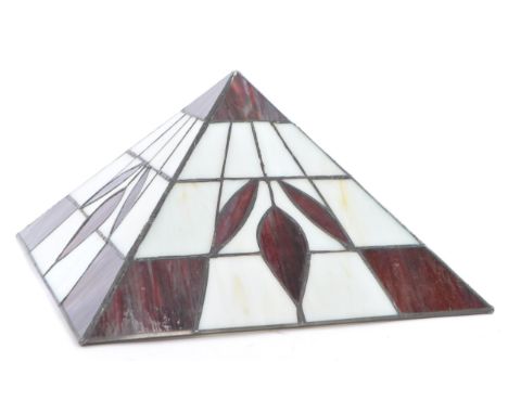 A 20th century Tiffany style glass lamp shade. The shade with cream and red glass panels to a four section angular frame with