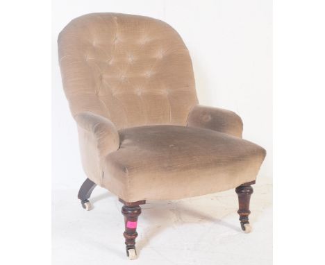A Victorian 19th century mahogany framed library button back tub armchair. Having an arched button back padded back rest, wit
