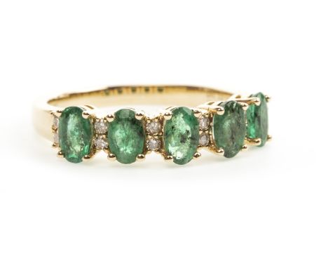 EMERALD AND DIAMOND RING, set with five oval emeralds totalling approximately 1.02 carats, with accompanying WGI report numbe