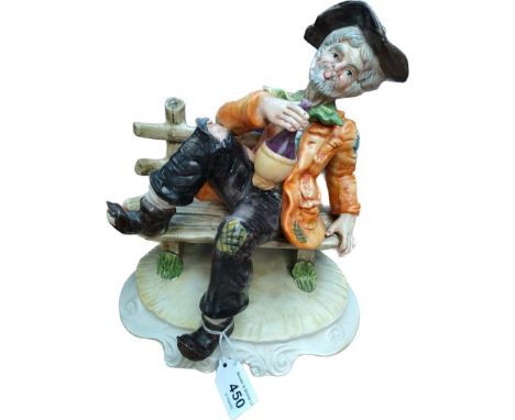 Vintage 1960's Capodimonte figure of a tramp on a bench. [25cm high]