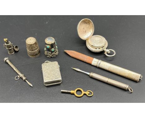 Selection of silver items; Birmingham silver sovereign holder, Victorian silver small vesta case, B/ham silver revolving toot