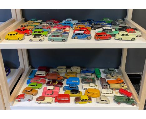 Two shelves of playworn car models, mostly Corgi and Dinky 
