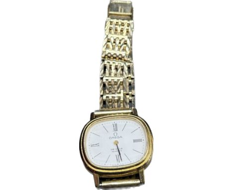 Vintage ladies Omega De Ville Quartz fitted with a 9ct yellow gold gate bracelet. Comes with booklet and modern omega box. 