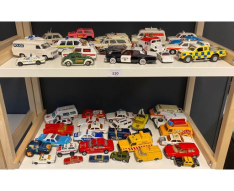 A large collection of playworn police and emergency services vehicles mostly Dinky and Corgi 