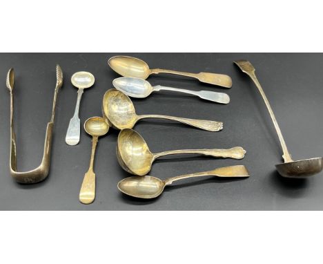A Selection of various silver marked cutlery/ flatwares; Victorian Glasgow silver sugar tongs, A Pair of London silver ladles