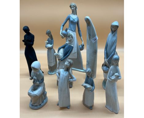 A Collection of Lladro and Nao Figures and various others; Large Nao women carry two flagons, Lladro Madonna, Large Lladro fi