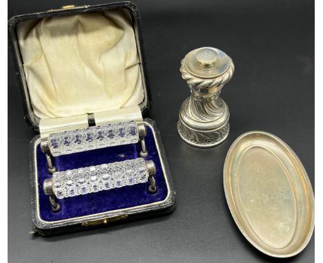 Three various items of silver; Boxed pair of Chester silver and cut crystal cutlery rests, Birmingham silver ornate pepper gr