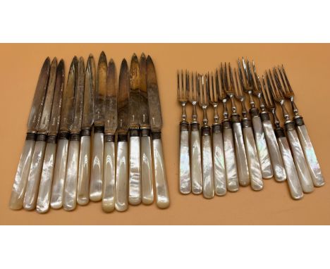 A Set of Twenty Four fork &amp; Knives; fitted with mother of pearl handles and Sheffield silver collars. 