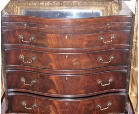Mahogany chest of drawers with serpentine front and sliding tray, Chinese Chippendale borders, bracket feet, 33"w x 21"d x 32