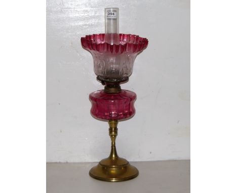 Victorian Table Oil Lamp, brass base, red glass bowl and a tulip shaped red tipped shade, 24”h