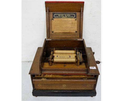 Musical Seraphone, in mahogany case, stamped Peter Black, Manchester, with directions for playing (not working)