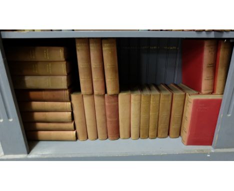 Shelf of Novels by the authors Charles Dickens & Thackery, red cloth covers, most illustrated (worn)