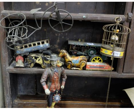 Shelf of old tin toys &amp; a Tudor man (all damaged)