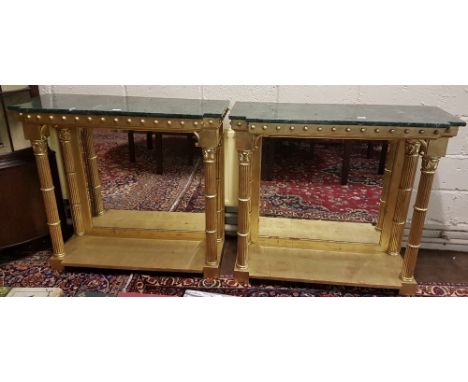 Matching pair of console tables, with breakfront green marble tops over a base supported by Doric columns, with bevelled mirr