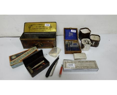 Shelf of Cut Throat Razers, spectacles etc