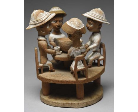 Thomas Ona. A Yoruba tea party groupNigeriawith two couples seated around a table, each with a tea cup and saucer and a large