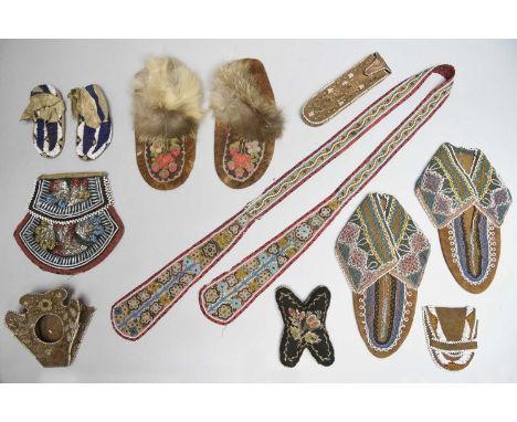 Three pairs of North American moccasinsincluding a Sioux child's pair, hide, beads and ribbon, 12cm long, a Cree pair with fu