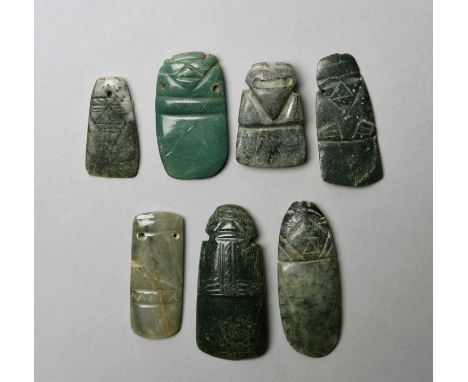 Seven Guanacaste Nicoya pendantsCosta Rica, circa 100 - 500 ADjade, with avian or figural representation and one with two hor