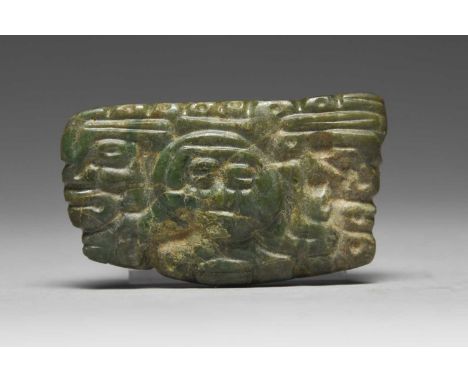 A Maya pendantGuatemala, circa 400 - 900 ADjade, carved a central bust and one to each end, drilled through the top for suspe