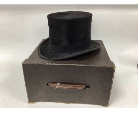 A Black Silk Top Hat for Dunn &amp; Co' Strand, Oxford Street London, dated 1911 (inner measurements 20 x 16cm) in original c