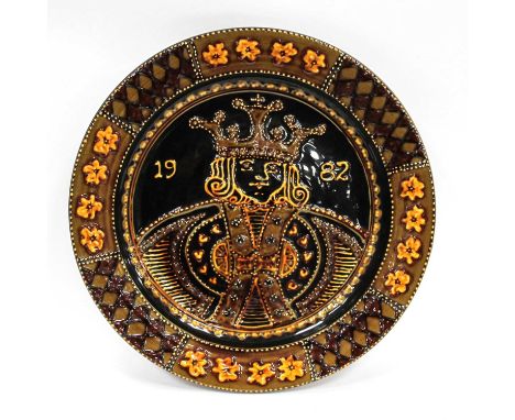 John Pollex; Studio Pottery large Slipware Charger marked 1982 depicting a king on brown ground, with impressed marks to back
