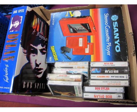 A Sanyo Model M-G7SP Sportster Stereo Cassette Player (In Red), ten Bob Dylan cassette tapes, Dylan biography.