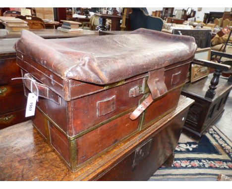 AN UNUSUAL AND RARE ANTIQUE BRASS BOUND LEATHER EXPANDING TRAVELLING TRUNK. WITH BRASS LABEL W. DAY PATENTEE AND MANUFACTURE 