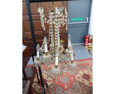 A VINTAGE FRENCH STYLE GILT BRASS FRAME NINE LIGHT CHANDELIER, FLOWER HEADS WITH SWAGS AND PRISMS 