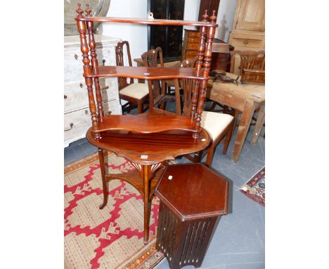 AN EDWARDIAN INLAID SHAPED OVAL TWO TIER TABLE. A THREE TIER HANGING SHELF AND A ARTS AND CRAFTS STYLE STAND (3)