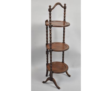 A Mahogany Three Tier Cake Stand with Bobbin Knopped Supports, 90cms High