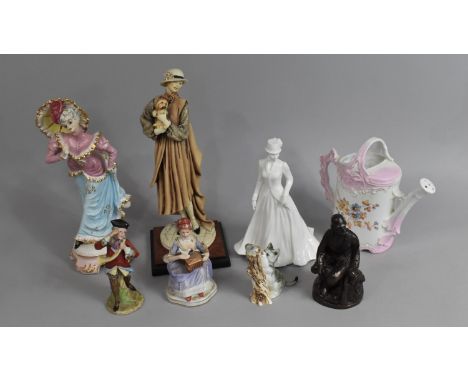 A Collection of Various Resin and Ceramic Figural Ornaments 