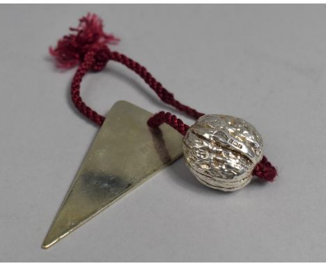 A Silver Study of a Walnut, 80g on Rope with Triangular Item 