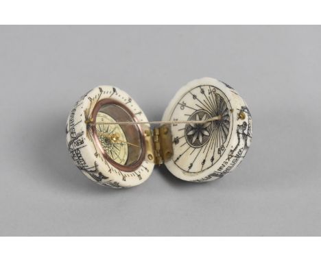 A Reproduction Small Bone Scrimshaw Style Compass in the form of a Hinged Globe, 3.5cm Diameter 