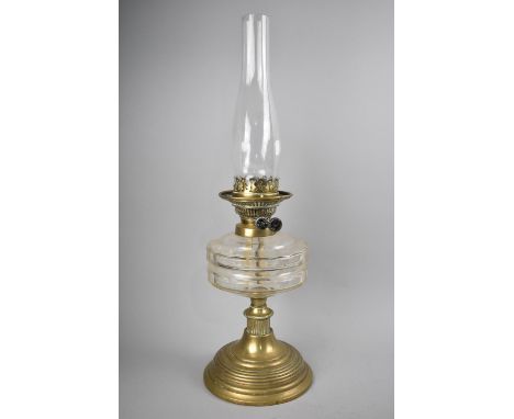 A Late 19th Century Brass and Glass Oil Lamp, Clear Glass Reservoir with Faceted Design, Complete with Chimney but no Shade, 