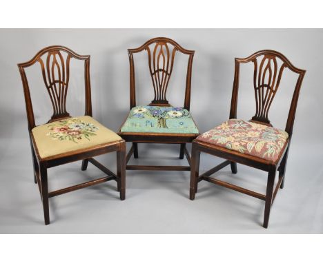 A Set of Three Mahogany Framed Dining Chairs with Tapestry Seats, Tapering Square Supports Joined by Stretchers 