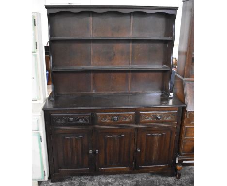 A Mid 20th Century Dresser with Three Short Drawers Surmounting Cupboard Base with Two Shelf Plate Rack, 135cms Wide 