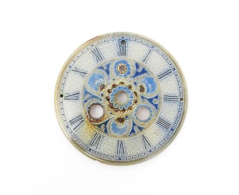 A Martin Brothers stoneware clock dial, circular with pierced apertures, incised with foliate panels glazed blue and brown on