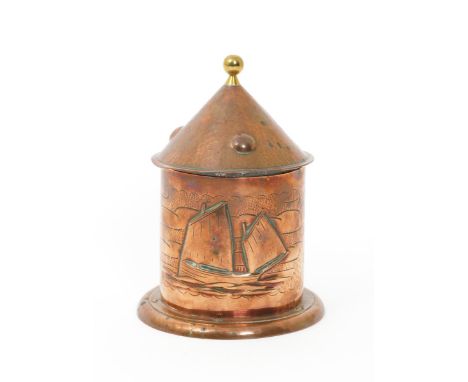 A Herbert Dyer repousse copper tobacco jar and cover,  cylindrical  form with flaring rivetted foot, the cover tapering conic