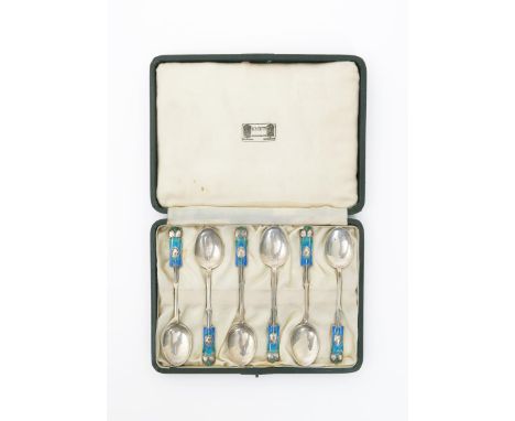A set of six Liberty & Co silver and enamel teaspoons designed by Archibald Knox, in original fitted silk case, cast in low r