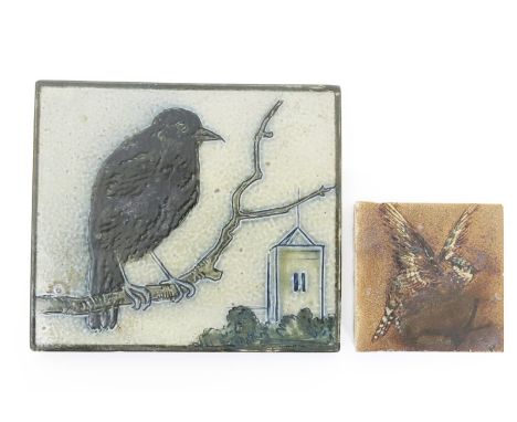 A Martin Brothers stoneware tile, incised with a crow perched on a bough before a church, in shades of black, brown and green