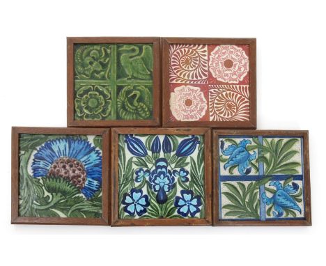 A William De Morgan Merton Abbey tile, modelled in low relief with quartered panels of bird and flower motif, glazed green, a