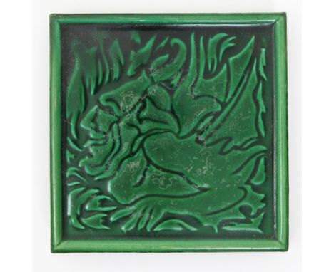 A J C Edwards tile teapot stand designed by C F A Voysey, decorated with a grotesque creature, glazed green impressed marks t